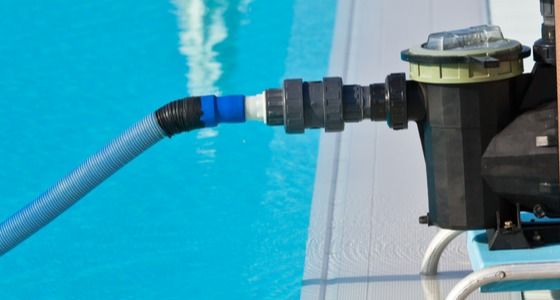 Pool pump operating in pool