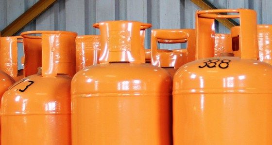 Orange LPG gas cylinders lined up