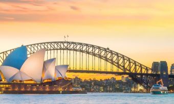 Sydney Harbour Bridge and Opera House with sunset background