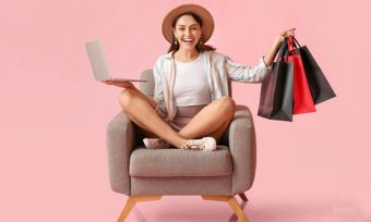 Happy young woman using laptop and online shopping