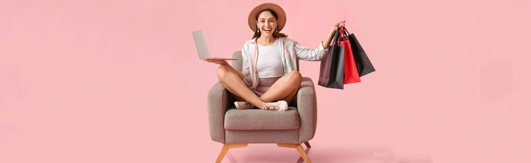 Happy young woman using laptop and online shopping