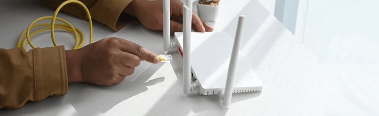 Closeup of man configuring modem. Modem setup guide