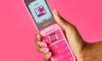 Pink Barbie Flip Phone in woman's hand