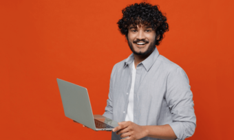 Happy man using laptop