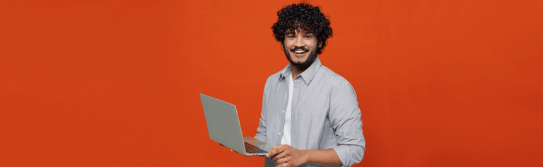 Happy man using laptop